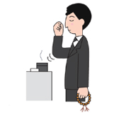 2.遺影に向かって一礼し、合掌。右手の親指と人差し指、中指の3本で抹香をつまみます。