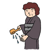 1.ひしゃくで水をくみ、左手に３分の１をかけます。